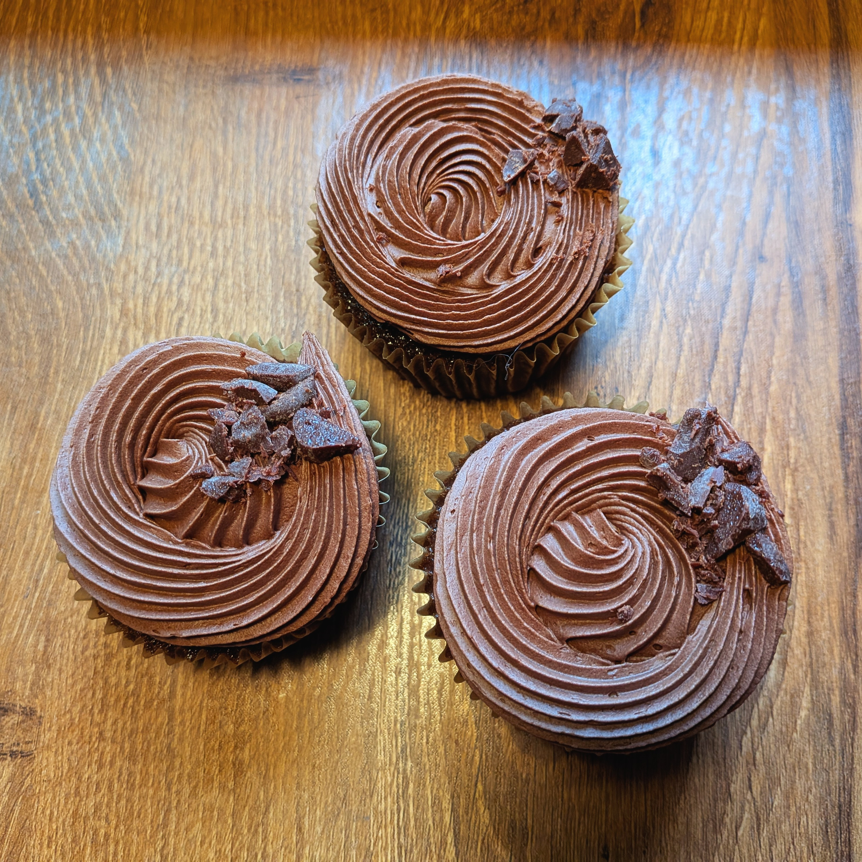 Picture of chocolate cupcake on desk from above